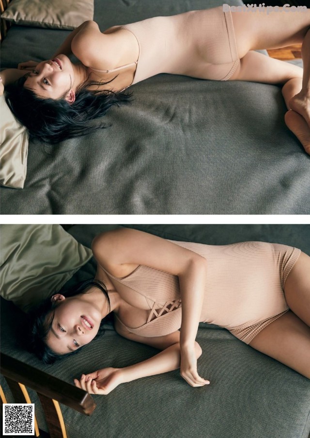 A woman laying on a bed in a nude bodysuit.