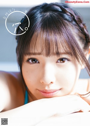 a japanese woman in a white bra top is laying on a bed