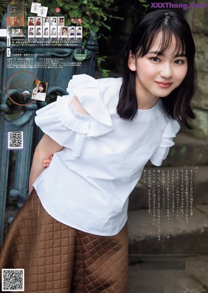 A magazine with a woman in a white dress on the cover.