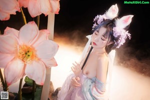 A woman in a bunny costume posing for a picture.